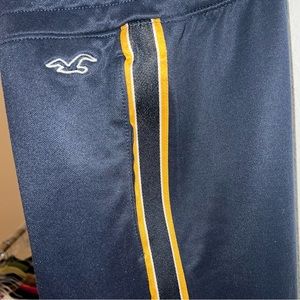 Hollister men’s large track pants. Navy blue with gold stripe accents. Large